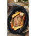 Removable stoneware slides right out of the base for easy transport to the table or storage in the fridge. Large roast and vegetables are cooking inside inner pot.