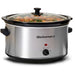 8.5 Qt. Stainless Steel Slow Cooker and glass lid with beef stew cooking inside pot.